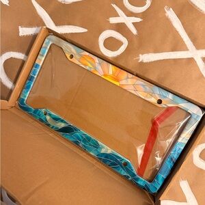 Sun and Waves license plate cover